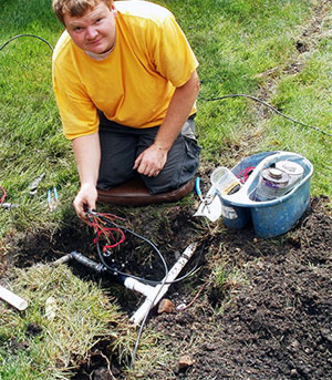 a Mississauga irrigation contractors is fixing a broken valve