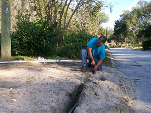 one of our techs is adding the new pipes in the ground